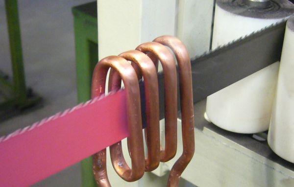 Inductive annealing of a saw band
